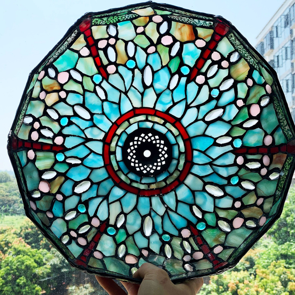 Tiffany style table lamp casting a soft serene glow through emerald and ruby dragonfly stained glass in nature inspired interior