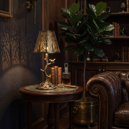 Small metal lamp shade for table lamp with forest cutout design, creating warm shadow patterns in a vintage luxury living room.