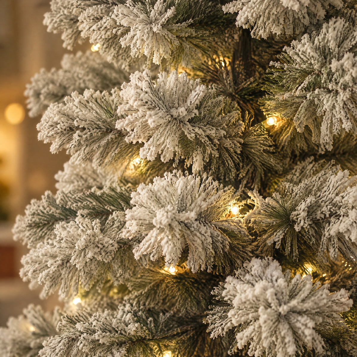 Close-up of realistic green artificial spruce needles covered in white flocking, with warm LED string lights glowing between the snowy branches.
复制本图 SEO 信息