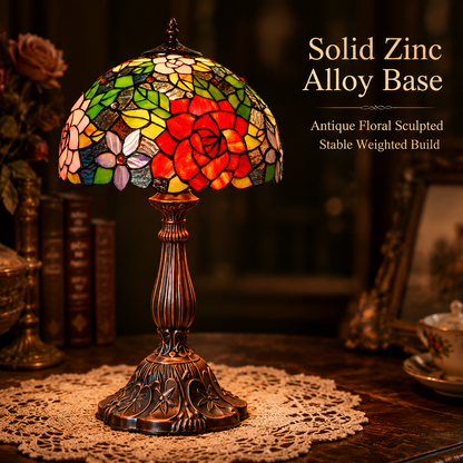 Antique bronze zinc alloy base with carved floral details on a classic Tiffany table lamp