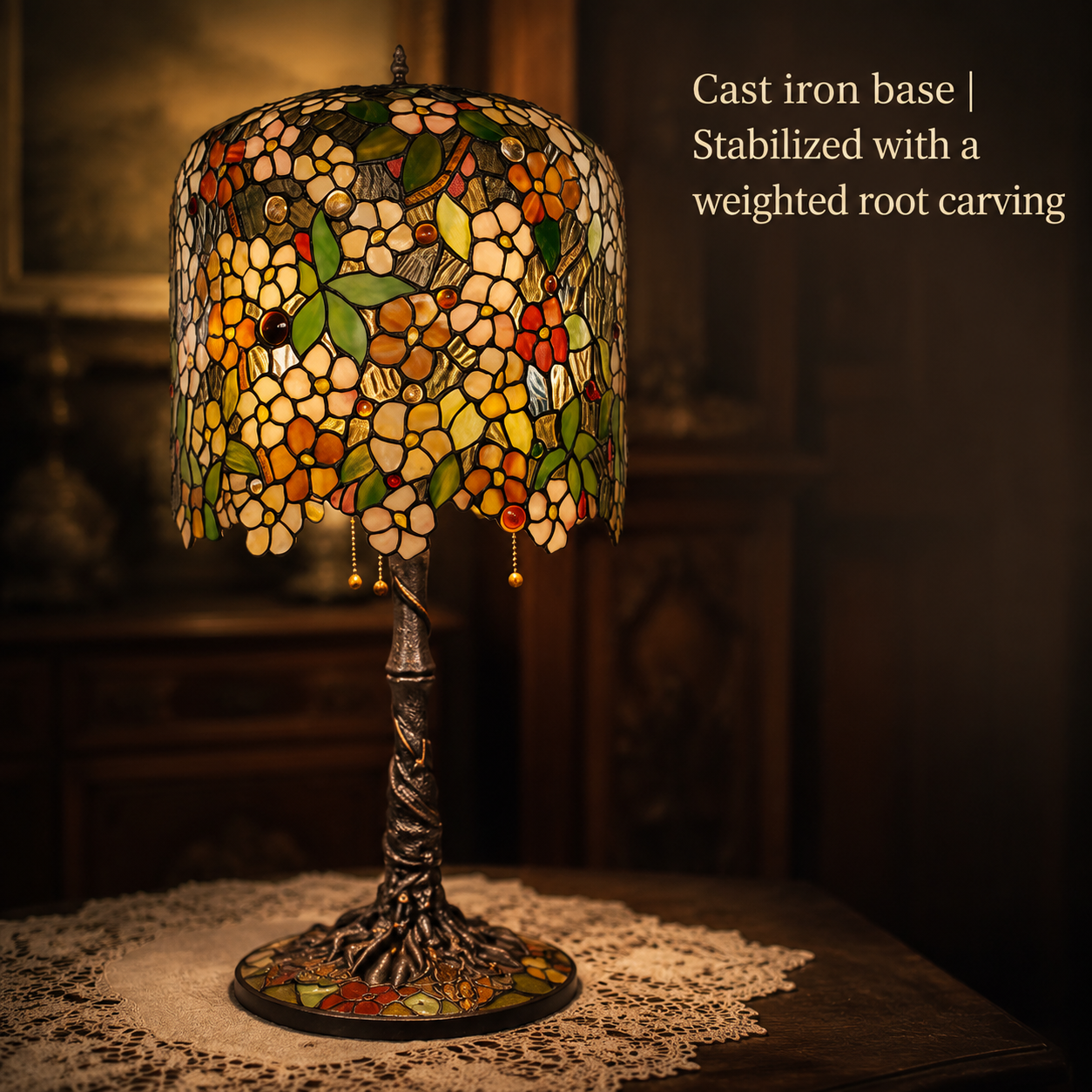 Apple Blossom Tiffany table lamp featuring an antique cast iron base with detailed carved craftsmanship and vintage artistic design
