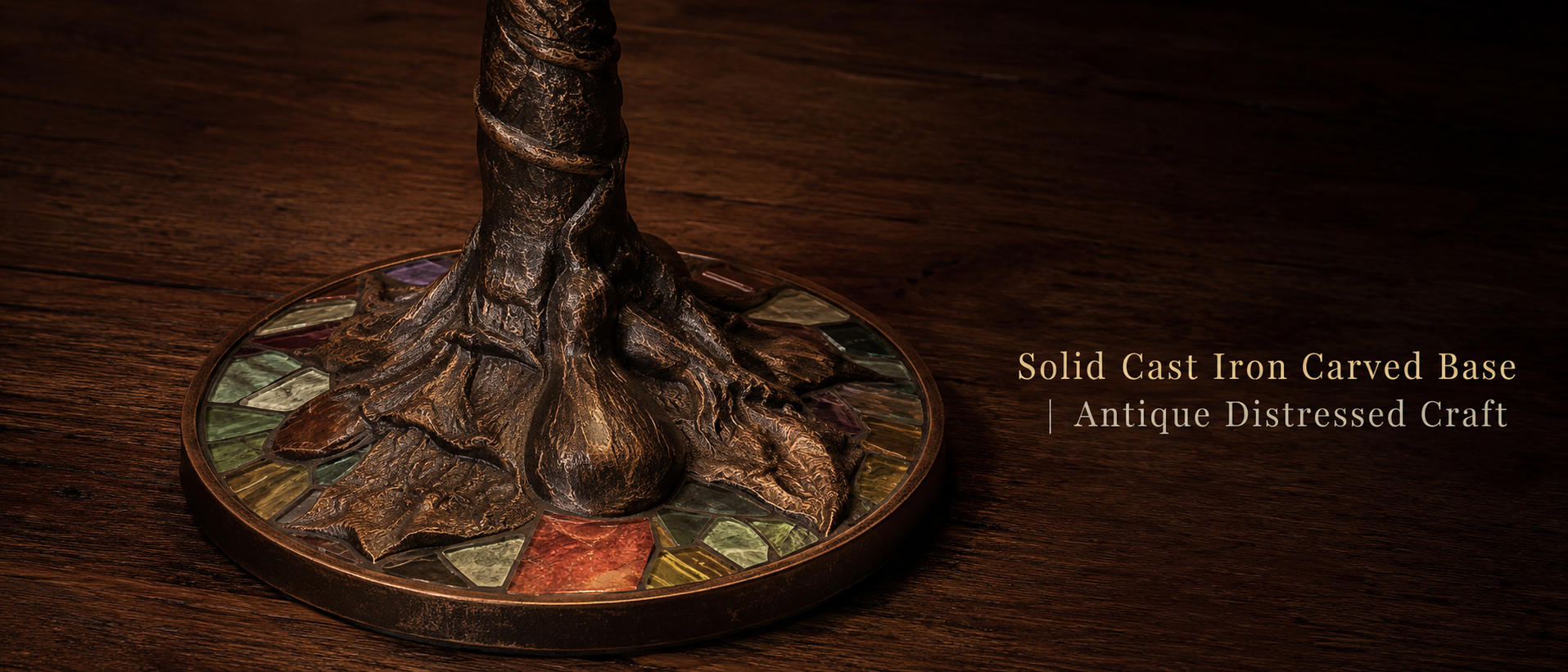 Antique cast iron base detail of Wisteria table lamp showing carved metal texture and vintage craftsmanship