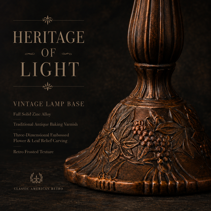 Close up view of antique zinc alloy base with embossed grape vine details on a handcrafted Tiffany table lamp
