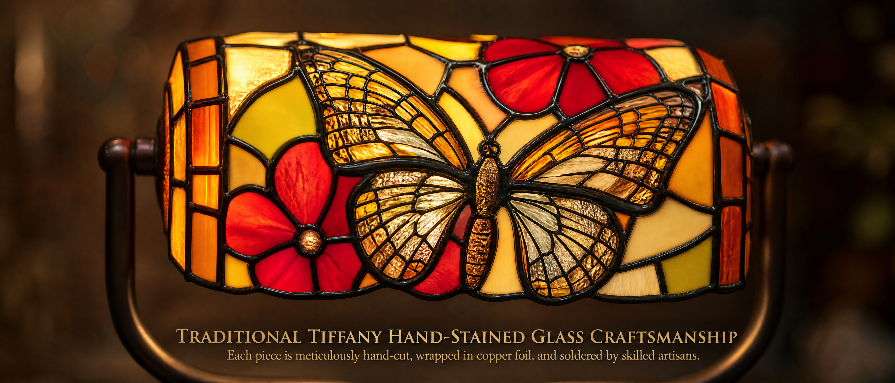 Close-up of Tiffany style butterfly banker lamp featuring handcrafted stained glass butterfly and red floral pattern with copper foil details