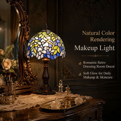 Blue and lavender wisteria stained glass table lamp used as decorative vanity lighting beside an antique mirror