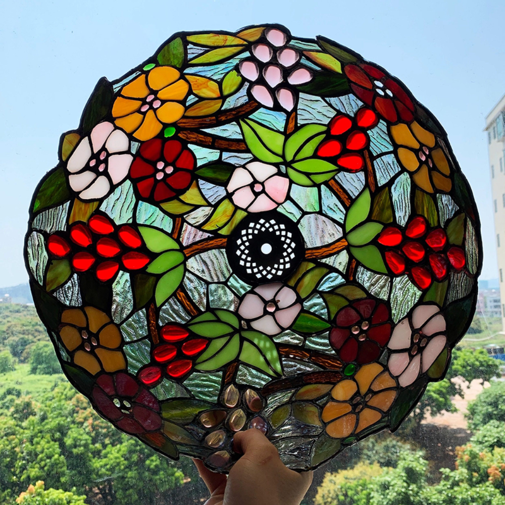 Colorful floral stained glass table lamp enhancing bohemian living room decor with warm ambient lighting