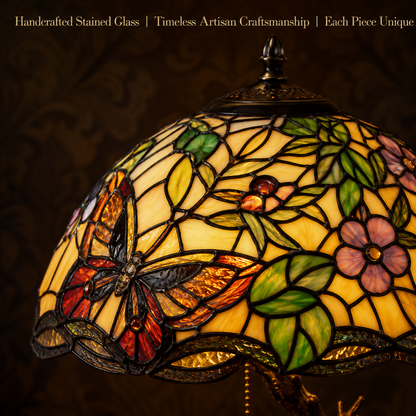Close up view of handcrafted butterfly stained glass lampshade featuring floral patterns and colorful mosaic glass details