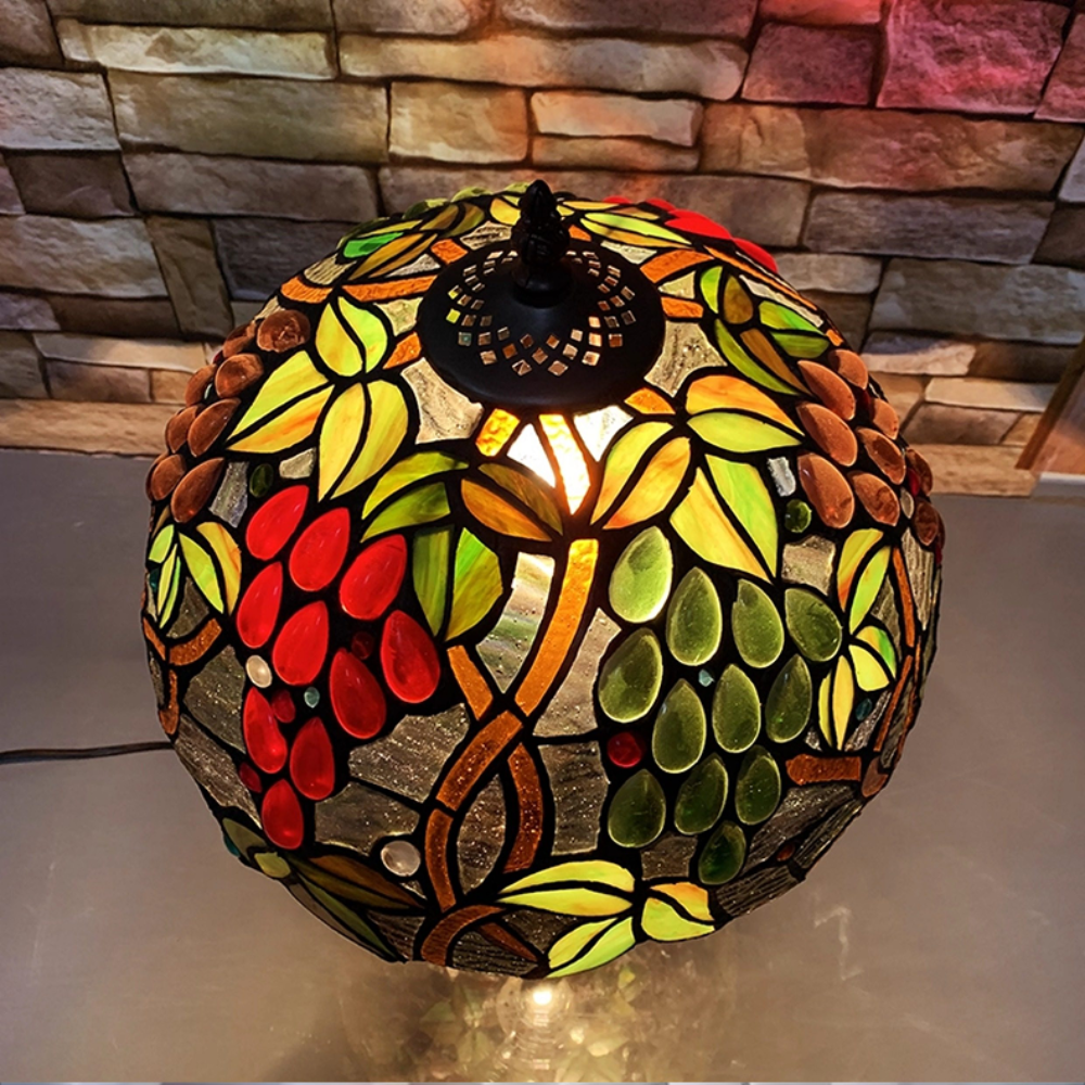 Vintage fruit stained glass table lamp enhancing cottagecore living room decor with warm ambient lighting