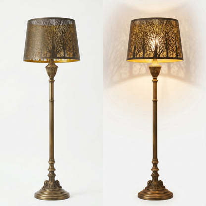 Drum Tree Etched Metal Lamp Shade - On/Off Comparison on Vintage Brass Floor Lamp Against White Background, Left View Shows Bronze Tree Pattern Exterior When Off, Right View Shows Warm Tree Shadow Projection with Gold Interior When Lit, 10" x 12" x 8" Replacement Shade for Floor Lamps and Table Lamps, Perfect for Modern and Vintage Interiors