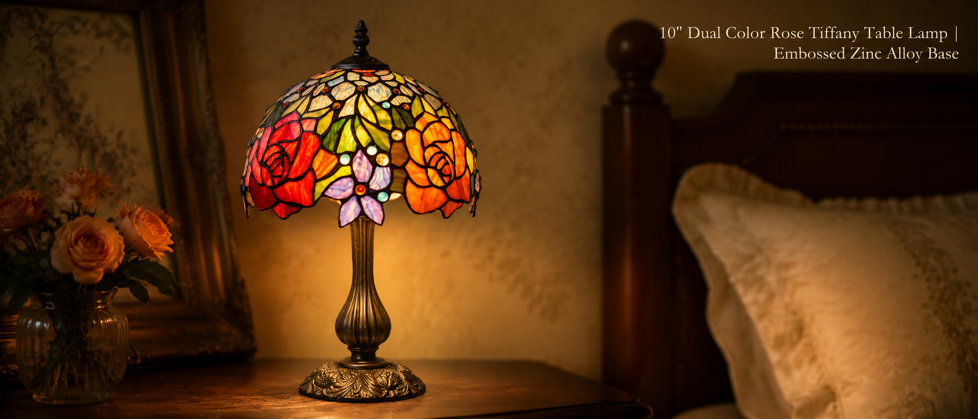 Tiffany style rose bedside lamp with red and golden floral stained glass shade displayed on a vintage bedroom side table
