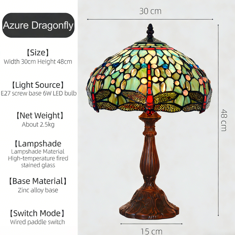 Dragonfly Tiffany table lamp featuring emerald and ruby stained glass with antique bronze base and soft ambient lighting