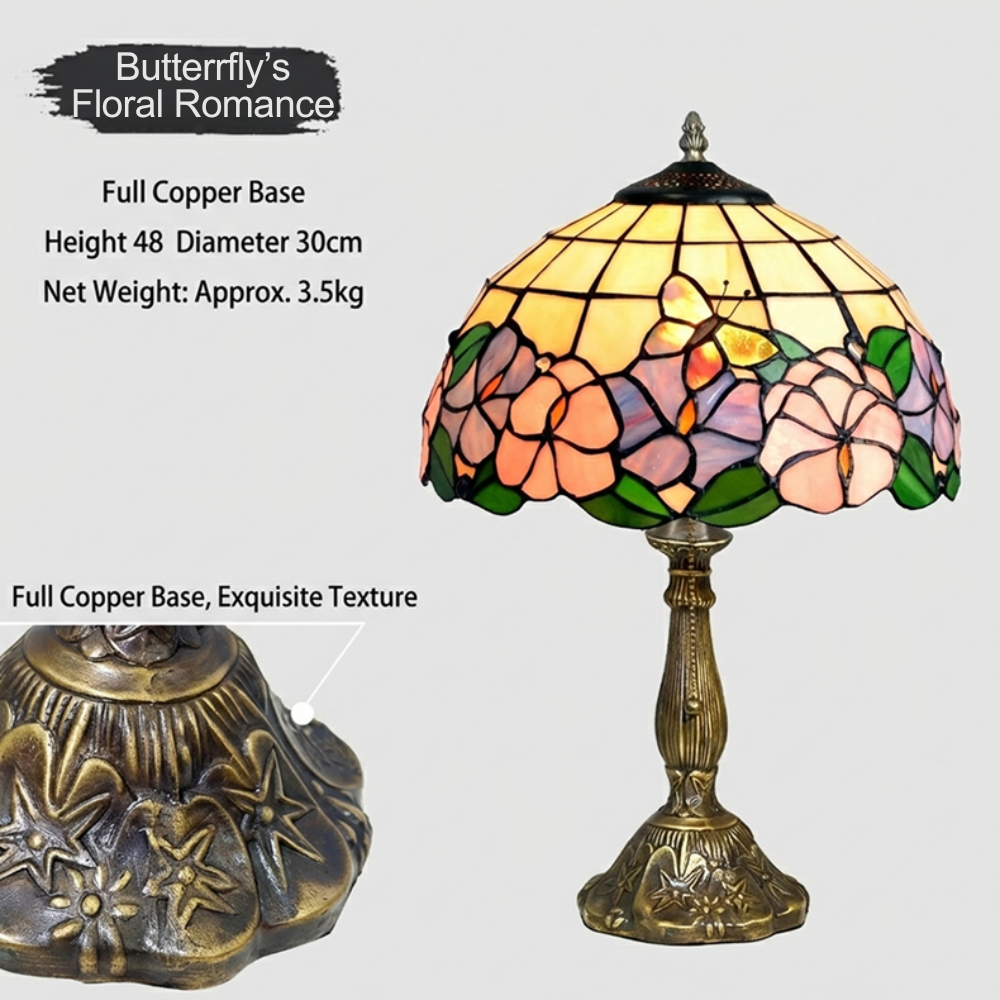 Close-up of handcrafted stained glass shade with floral and butterfly patterns in soft lavender and pink colors
