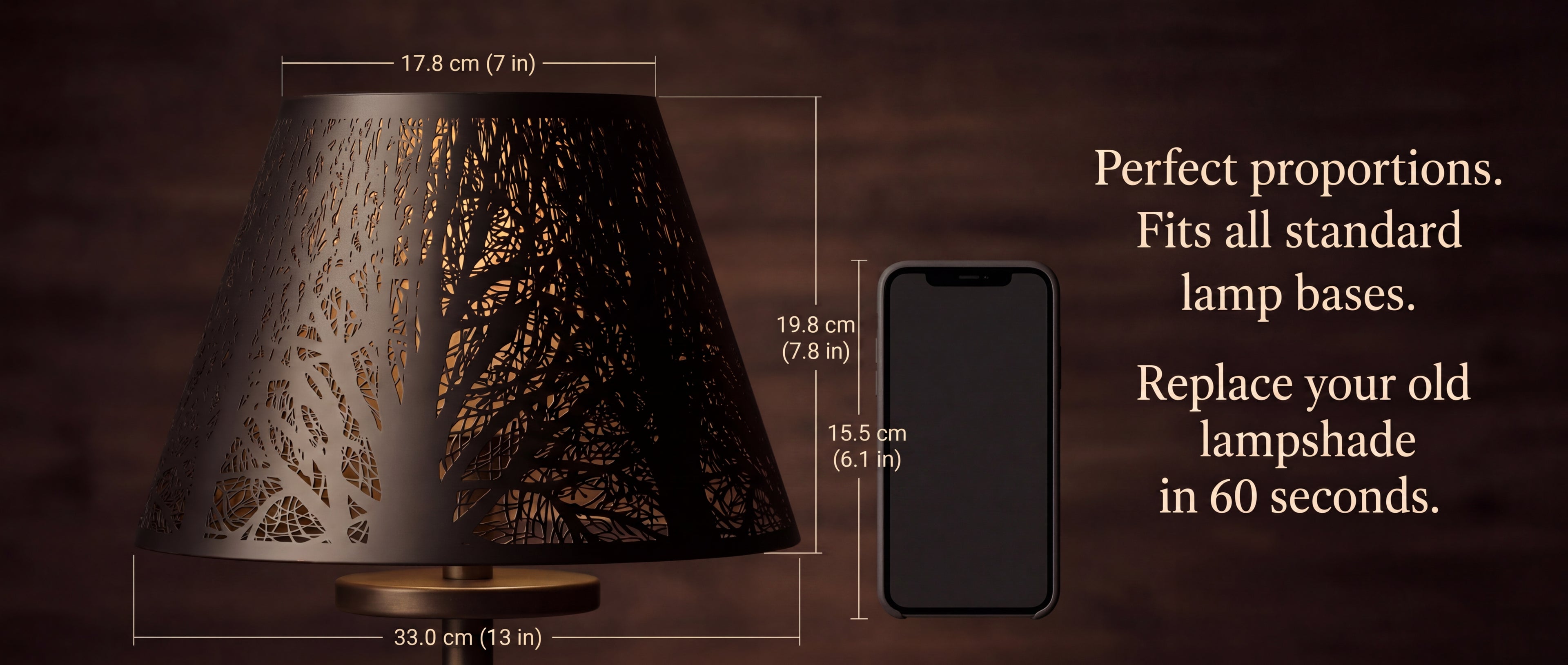 Modern Forest Etched Metal Lamp Shade Size Reference Chart - "Perfect Proportions. Fits All Standard Lamp Bases. Replace Your Old Lampshade In 60 Seconds" - Top Diameter 17.8cm (7 in), Bottom Diameter 33.0cm (13 in), Height 19.8cm (7.8 in), Compared to Standard 6.1 in (15.5cm) Smartphone - Shown on Vintage Brass Lamp Base on Wood Background - Black Metal Laser-Cut Tree Pattern with Gold Interior - 7" x 13" x 7.8" Standard Size Spider Fitter Replacement Shade for Floor Lamps and Table Lamps, Warm Ambient Lig