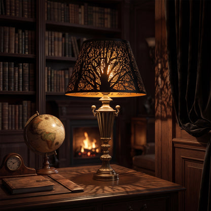 Modern Forest Etched Metal Lamp Shade on Ornate Brass Table Lamp in Vintage Study - Decorative Study with Antique Globe, Vintage Clock, Leather Books, Wood Desk Fireplace, Black Exterior with Gold Interior Casting Intricate Tree Branch and Leaf Shadow Projection on Wood Paneling, 7"x13"x7.8" Replacement Shade for Table Lamps, Floor Lamps, Decorative Fixtures, Warm Ambient Lighting for Modern and Vintage Interiors