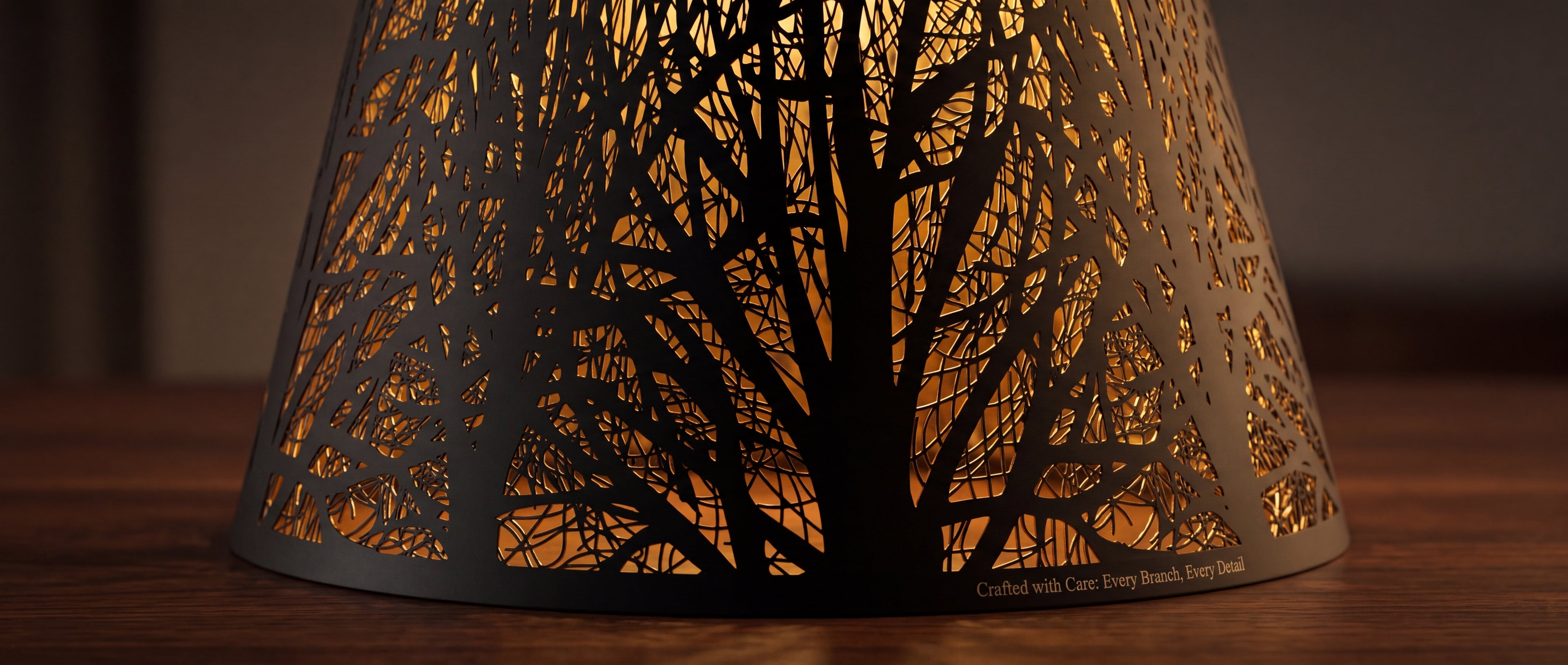 Close-up Detail View of Hand-Etched Forest Pattern on Small Metal Lamp Shade - Crafted with Care: Every Branch, Every Detail, Black Metal Exterior with Warm Gold Interior Lighting, 6"x10"x7.5" Spider Fitter, Decorative Replacement Shade for Table Lamps and Bedside Lamps