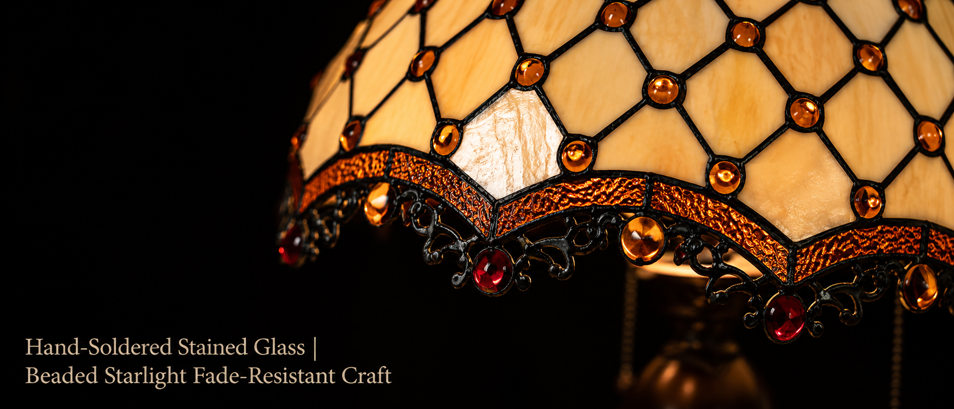 Handcrafted amber stained glass lamp shade featuring geometric patterns and jewel bead decorative details