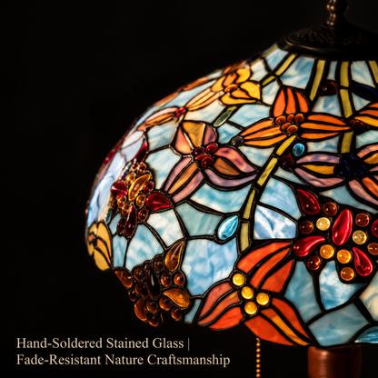 Close-up view of handcrafted dragonfly stained glass lamp shade featuring colorful floral mosaic glass craftsmanship