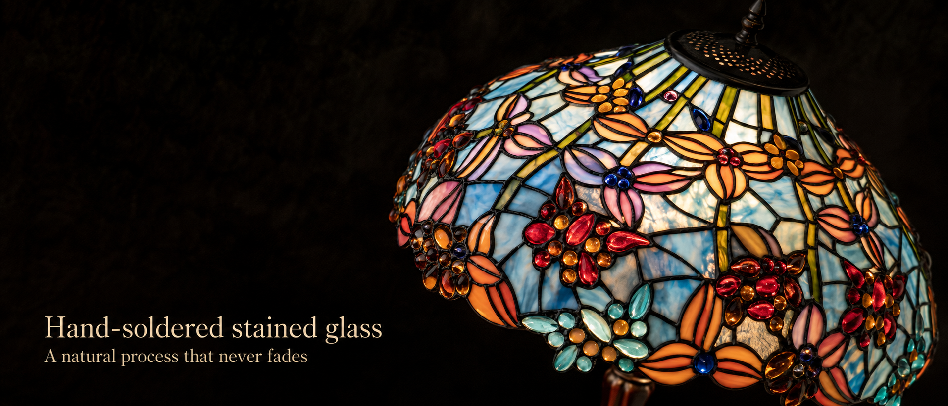 Handcrafted leaded glass lamp shade featuring colorful flower patterns and detailed stained glass craftsmanship
