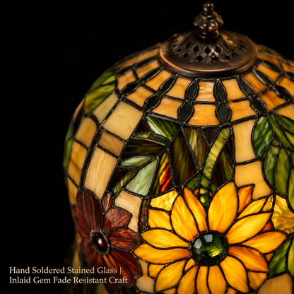 Close up view of handcrafted sunflower stained glass lamp shade featuring colorful floral glass pieces and artisan details