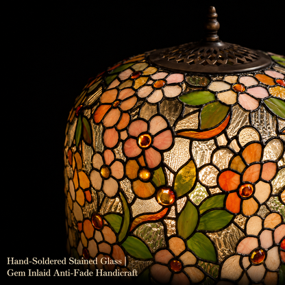 Close-up view of handmade Apple Blossom stained glass Tiffany lamp shade featuring floral patterns, colorful glass pieces, and traditional craftsmanship