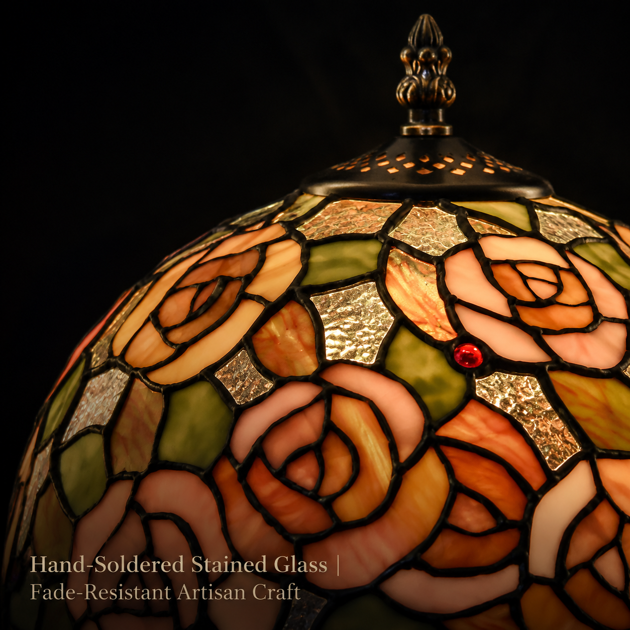 Close up view of handmade pink rose stained glass shade on Tiffany table lamp featuring floral glass pieces and traditional artisan craftsmanship