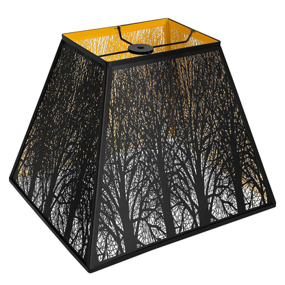 A black and gold pyramid metal lamp shade with etched forest details.
