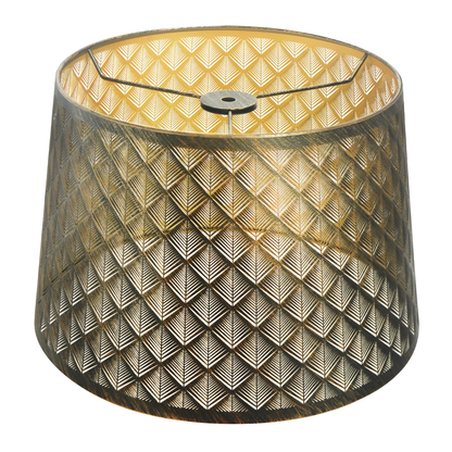 Lamp shades at home featuring a medium antique brass metal shade with detailed geometric cutouts and a warm gold interior