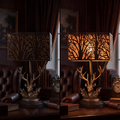 Large forest etched metal lampshade rectangular cube shape, on and off comparison, black exterior gold interior tree branch pattern on vintage deer antler table lamp