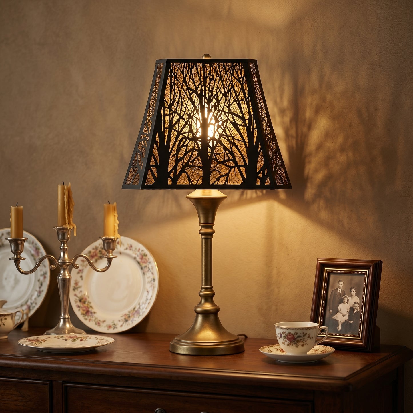 Large Rectangle Forest Etched Metal Lamp Shade on Vintage Brass Table Lamp - Decorative Display on Wood Cabinet with Silver Candelabra, Antique Floral China Dishes, Tea Cup, and Framed Vintage Family Portrait, Warm Beige Background Wall, Black Metal Rectangle Shade with Detailed Laser-Cut Tree Branch and Leaf Pattern Casts Intricate Forest Shadow Projection, Gold Interior Creates Warm Soft Ambient Lighting, 8" x 13.9" x 11" Replacement Shade for Table Lamps, Floor Lamps, Statement Lighting Fixtures, Perfect