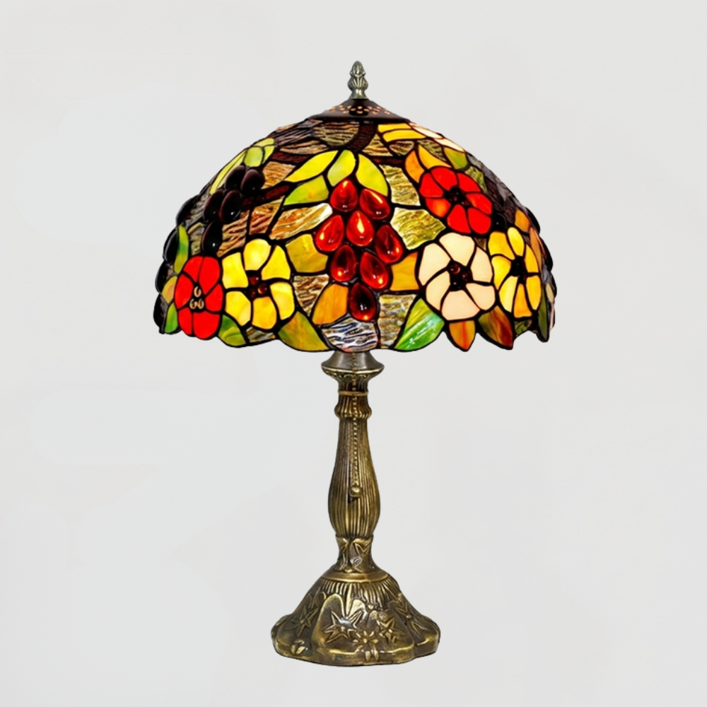 Aeelleea Tiffany colorful floral table lamp creating vibrant ambient lighting in artistic maximalist interior space