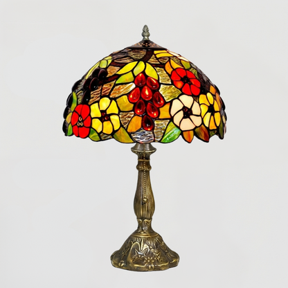Aeelleea Tiffany colorful floral table lamp creating vibrant ambient lighting in artistic maximalist interior space