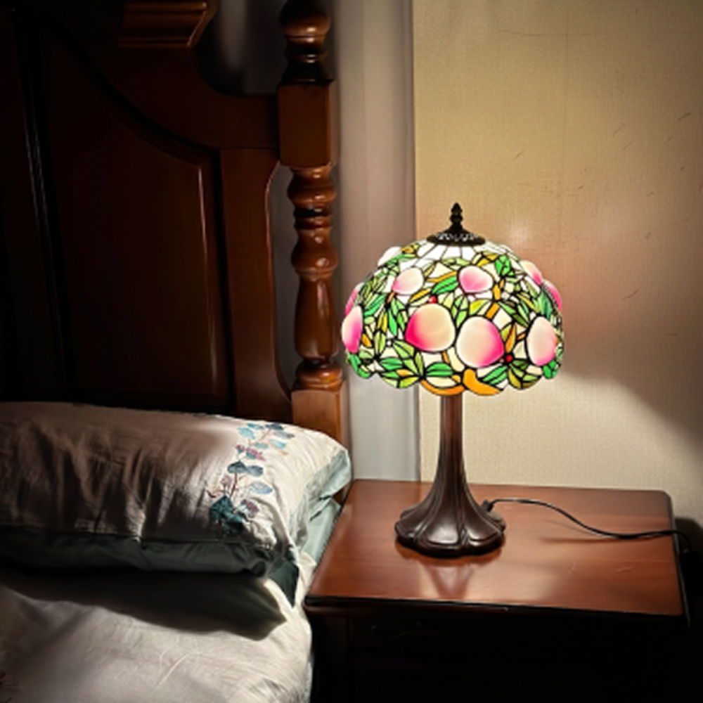 Peach fruit Tiffany table lamp featuring stained glass botanical design with antique bronze base and warm cottagecore lighting