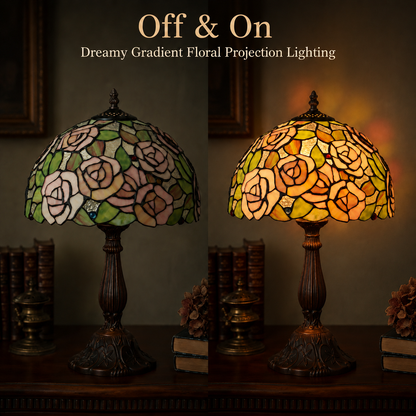 Pink rose Tiffany bedside lamp showing warm ambient glow with illuminated stained glass floral shade for cozy bedroom atmosphere