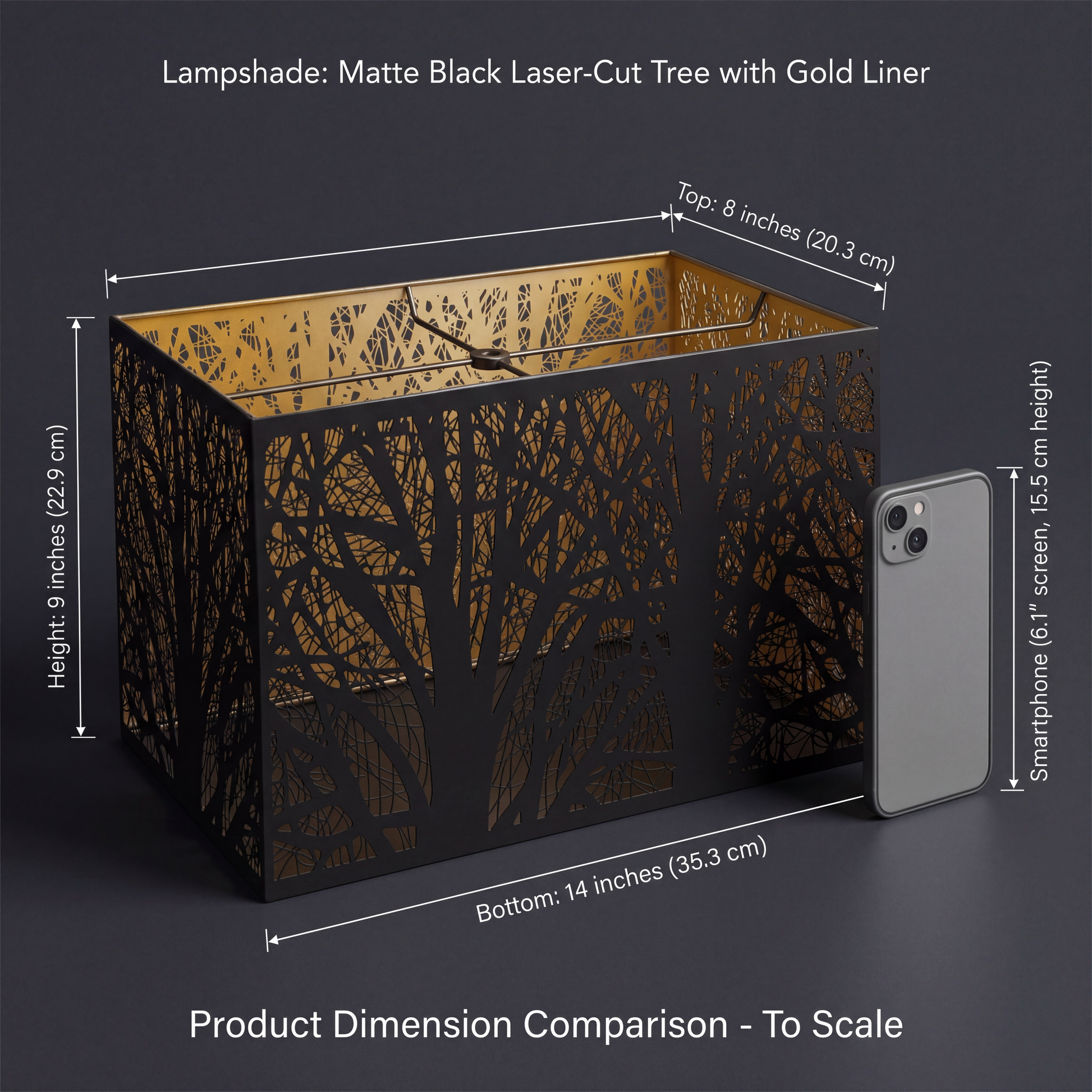 Rectangular Metal Lamp Shade - Product Dimension Comparison To Scale on Dark Grey Background - Product Title: Lampshade Matte Black Laser-Cut Tree with Gold Liner - Precise Dimensions: TOP 8 inches (20.3 cm), BOTTOM 14 inches (35.3 cm), HEIGHT 9 inches (22.9 cm) - Size Comparison with Standard 6.1 inch (15.5 cm Screen Height) Grey Smartphone - Shown from Slightly Above Angle Revealing Interior Spider Fitter Assembly for Standard Lamp Bases, Gold Liner Interior Visible Through Matte Black Laser-Cut Bare Tree