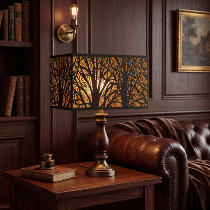 Rectangular Metal Lamp Shade with Laser-Cut Tree Pattern on Vintage Wood and Brass Table Lamp in Classic Dark Wood Paneled Study or Living Room - Brown Chesterfield Tufted Leather Sofa with Brown Throw Blanket, Dark Walnut Shelving with Antique Leather Books, Polished Dark Wood Side Table with Leather-Bound Book and Brass Inkwell, Brass Wall Sconce with Vintage Edison Bulb on Wood Panel Wall, Framed Landscape Oil Painting with Antique Gold Frame - Matte Black Metal Rectangle Shade with Intricate Laser-Cut B