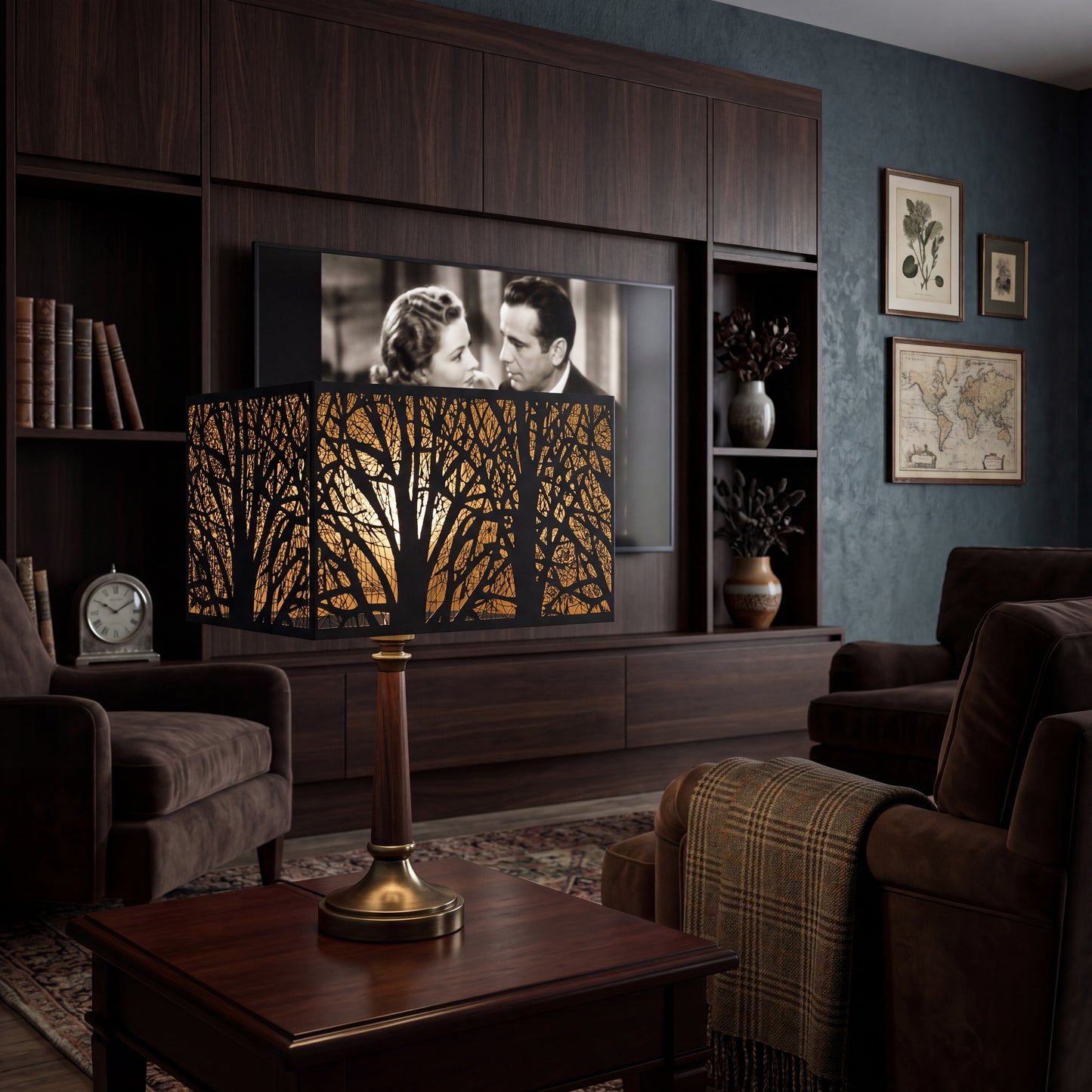 Rectangular Metal Lamp Shade with Laser-Cut Tree Pattern on Wood and Brass Table Lamp in Modern Dark Wood Home Theater Living Room - Brown Leather Sofa, Plaid Throw Blanket, Built-in Dark Walnut Media Cabinet with Flat-Screen TV Playing Classic Black-and-White Movie, Leather Books on Shelf, Brass Vintage Clock, Ceramic Vases with Dried Branches, Botanical Prints and Antique World Map Framed Art on Dark Blue-Green Textured Wall, Vintage Oriental Rug - Black Metal Exterior with Intricate Laser-Cut Bare Winter