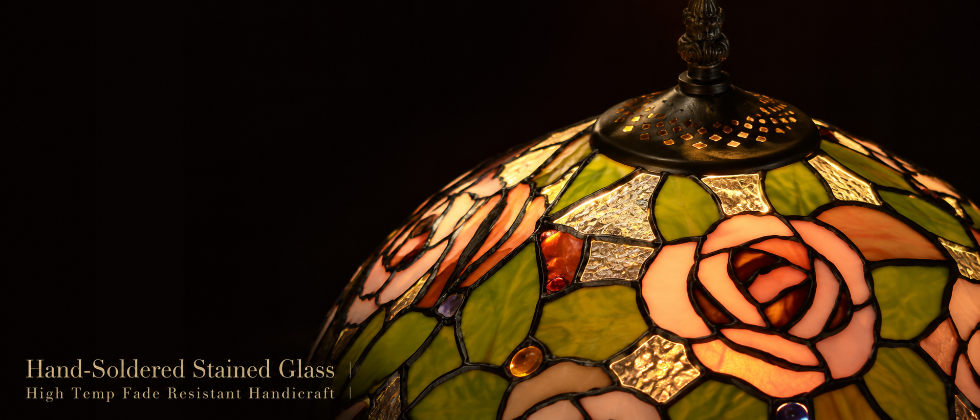 Close up of rose patterned leaded glass lampshade showing handcrafted soldered glass pieces and colorful floral details