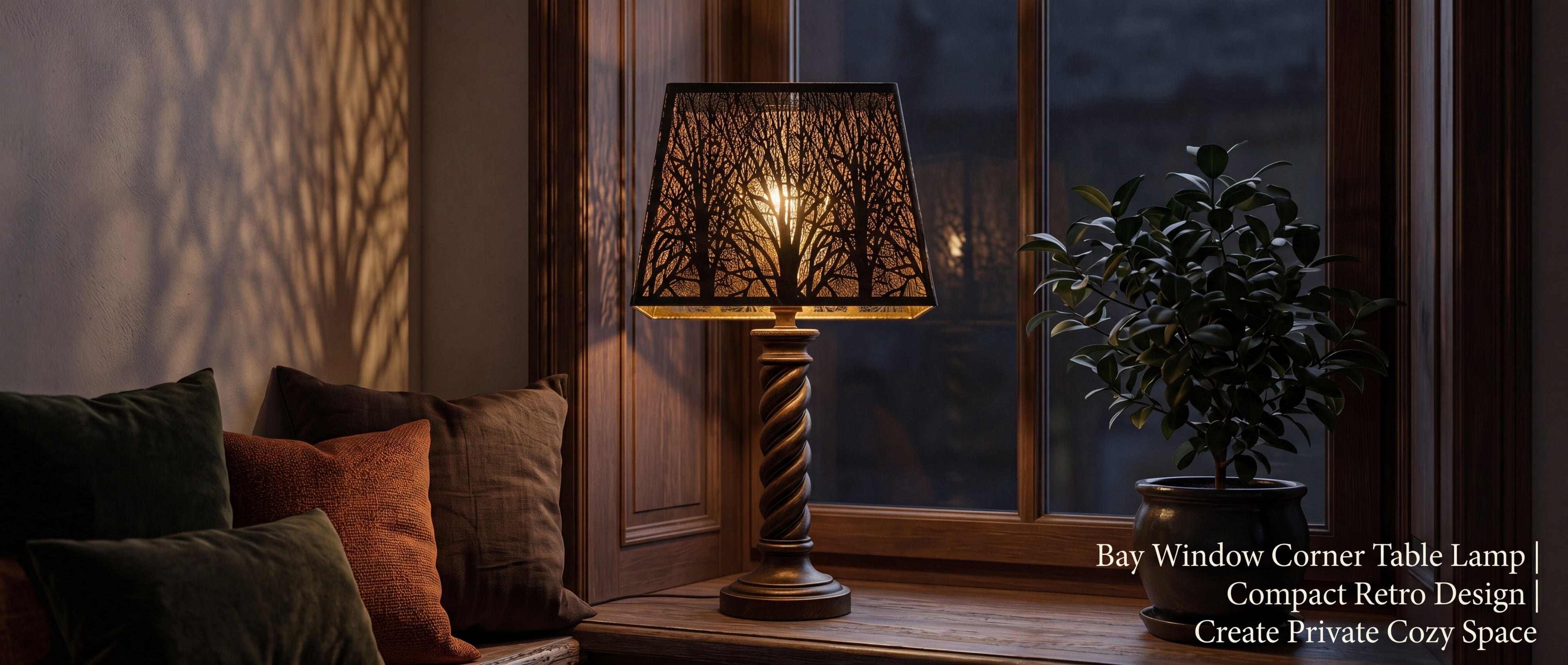 Rustic square metal lamp shade on twisted brass wood table lamp, compact retro design for bay window corner reading nook, forest etched woodland tree silhouette casting gentle tree shadow projection on wall, private cozy space with dark green brown rust throw pillows potted plant and wood panel window frame