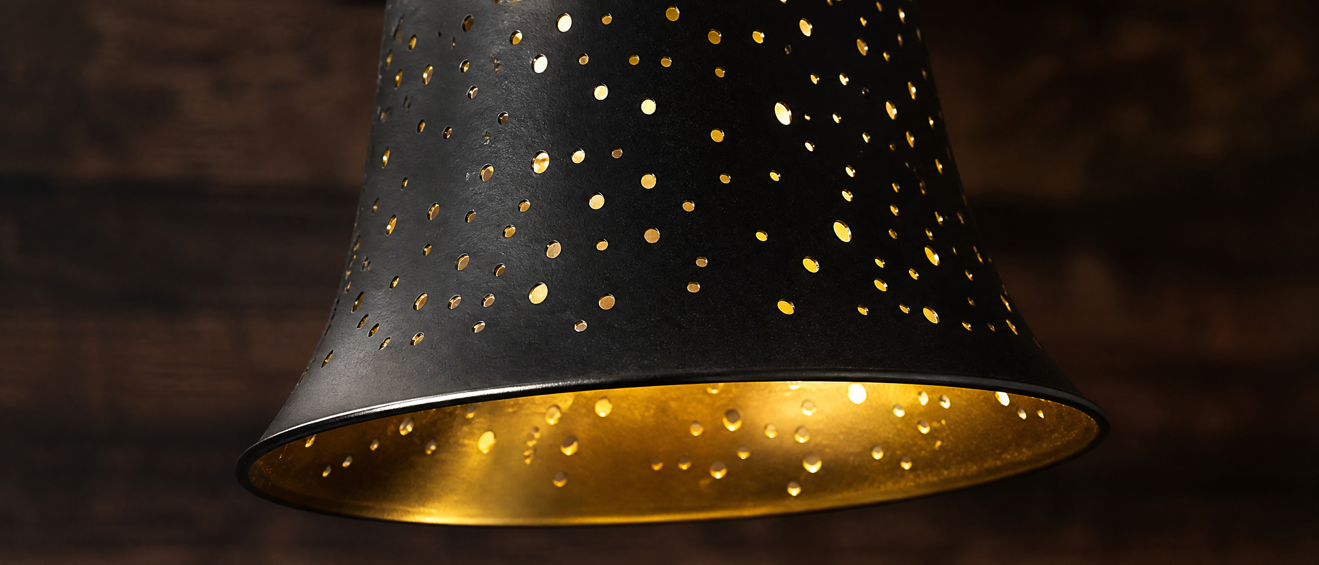 Close-up Detail View of Starlight Etching Metal Lamp Shade - Black Exterior with Delicate Starlight Pattern and Warm Gold Interior, 4-Pack 4.72 Inch Bell Shape Replacement Shades for Chandeliers and Wall Sconces, 1-5/8" Fitter for Decorative Ambient Lighting