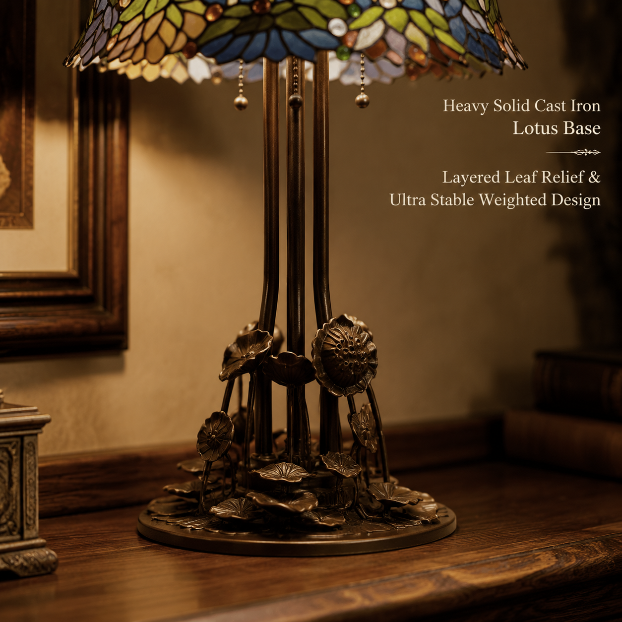 Vintage Tiffany lamp featuring a heavy cast iron lotus leaf base with antique botanical metal detailing