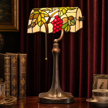 Tiffany style banker lamp with stained glass grape design and vintage metal base for study or office desk