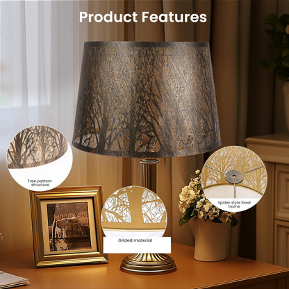 Close up of detailed tree etched pattern on drum metal lampshade highlighting decorative craftsmanship and texture