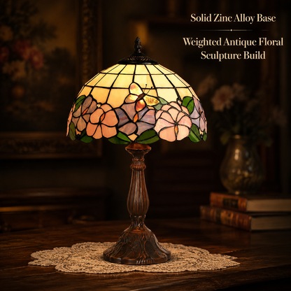 Vintage butterfly Tiffany table lamp with antique metal base creating warm ambient lighting for classic home interiors