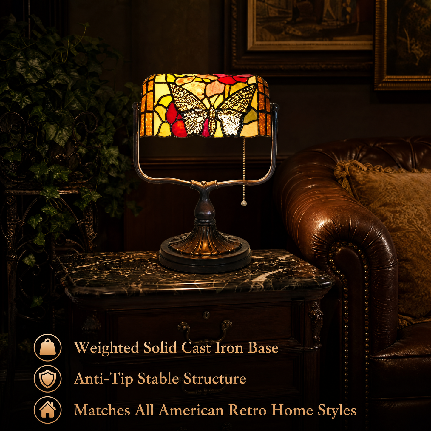 Vintage Tiffany style butterfly banker lamp with stained glass shade and weighted cast iron base on a living room side table